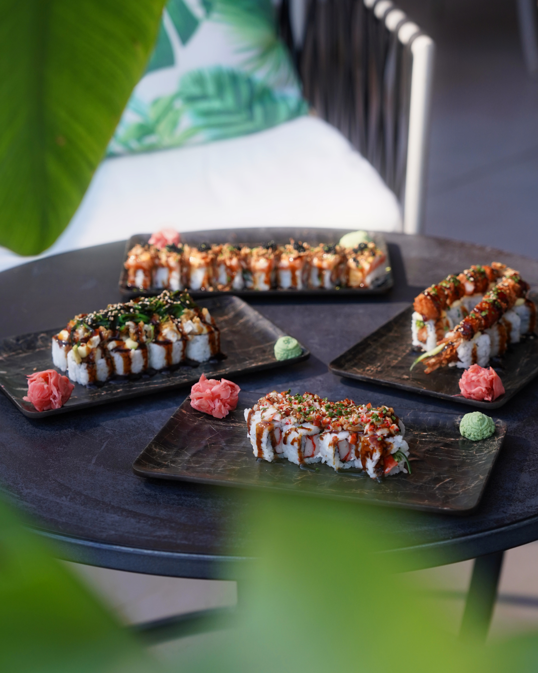Sushi platters laid out on a terrace table at Barok